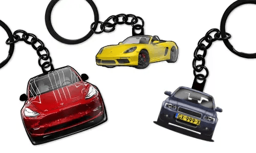 Personalized car keychains featuring a red sedan, a yellow sports convertible, and a blue sedan, designed as custom car accessories and gifts