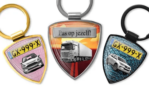 Shield-shaped photo keychain with car and truck designs