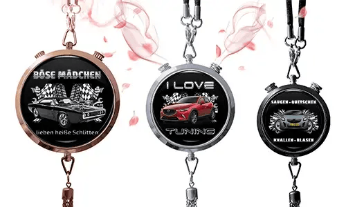 Three round pendants with car themes on black backgrounds. Left: vintage car with German text and checkered flags. Center: red SUV, 