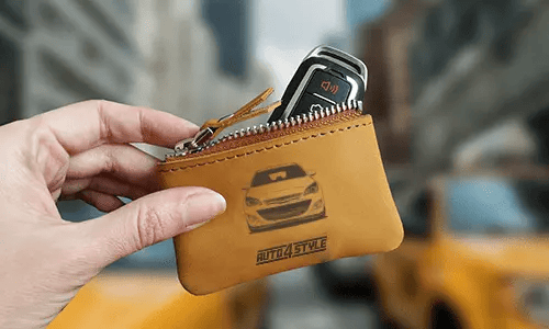 Brown zippered pouch with printed truck front and plate 