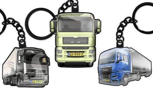 Truck keychains featuring three different lorry designs, including green, grey, and blue models