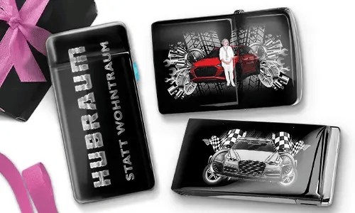 Three black and silver car-themed cigarette cases with dynamic graphics. One reads 