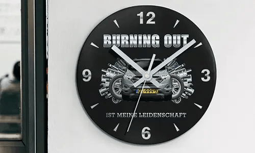 Wall clock with motorcycle and engine graphics, BURNING OUT IST MEINE LEIDENSCHAFT text on black face