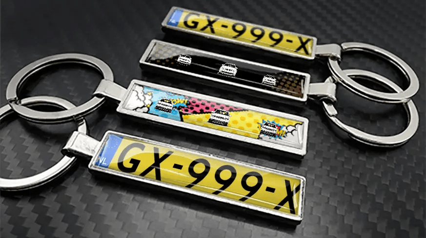Comic style metal keychains with car illustrations and custom license plate design